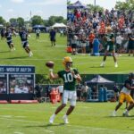NFL players practicing on the field during training camp with a graphic overlay reading "Training Camp Storylines - Week of July 24".