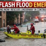 Texas Task Force 1 boat performing a rescue of a resident during a flash flood in a residential area."